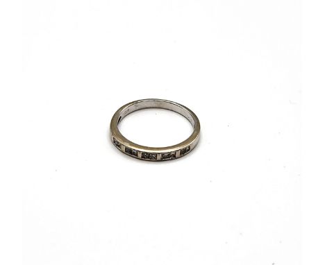 An 18ct white gold and diamond half eternity ring, marked 0.20 carat weight to shank, size K 1/2.&nbsp;2g