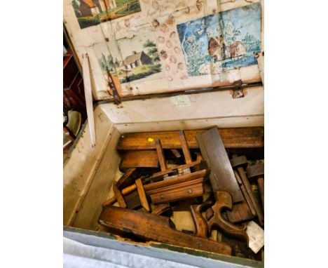An old wooden box and carpentry tools