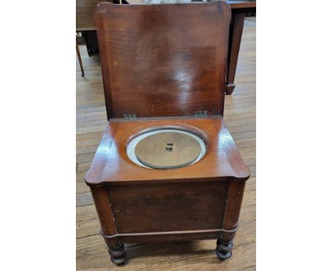 A late 19th century mahogany commode, hinged lid, raised on four turned legs. 44cm x 48cm x 42cm. 