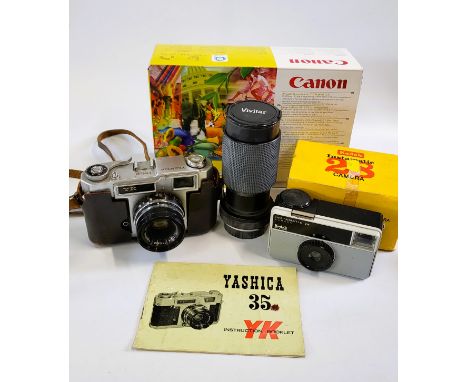 A Yashica 35mm camera, a Vivitar lens and a Kodak Instamatic 