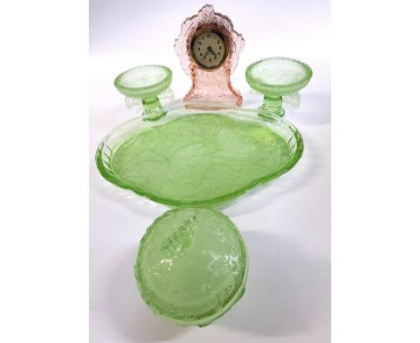 A green tinted pressed dressing table vanity set, tray 31cm wide and a pink tinted pressed glass clock 16.5cm. (2) 