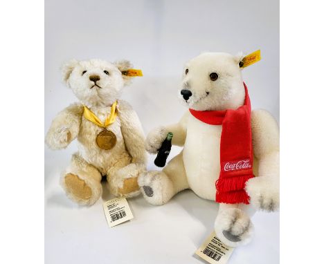 Steiff white Millenium Bear with medal and label 32cm, and a white Coca-Cola Polar Bear with label, 265cm. (2) 