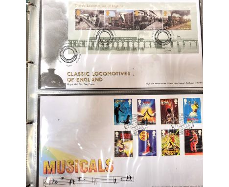 Two albums of First Day covers including: Book Five 2011 Classic Locomotives of England, Musicals, Magical Realms, WWF Safegu