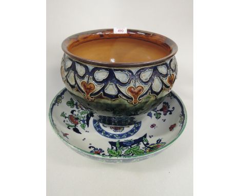 A Royal Doulton stoneware jardiniere having Art Nouveau foliate decoration on blue/green ground, impressed RT+6391 and a Loso