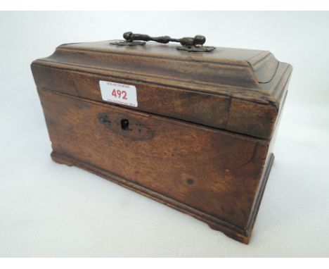 An early 19th century mahogany George III tea caddy having brass loop handle