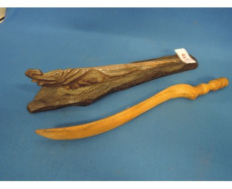 A vintage treen knitting stick and a treen carved model of a crocodile on stand