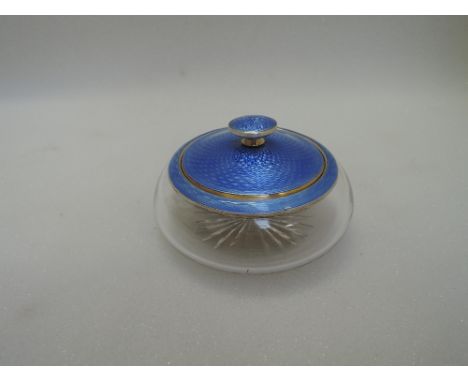 A glass dressing table pot having white metal and blue enamel guilloche collar and lid, bearing marks, worn but tested as sil