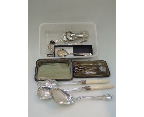 A cased travel part silver handled manicure set having floral decoration, Birmingham 1902, Levi & Salaman, and a small select