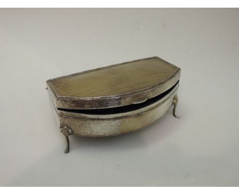 A silver dressing table box having engine turned decoration and plain cartouche to hinged lid, blue velvet lining and hoof fe
