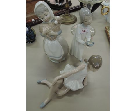 A Lladro figure modelled as sleepy time girl and two Nao figures modelled as girl holding lamp and a ballet girl