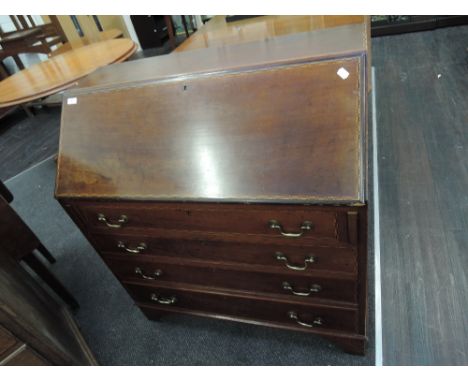 An Edwardian mahogany bureau having chequer inlay decoration with fall flap and drawers under, on bracket feet