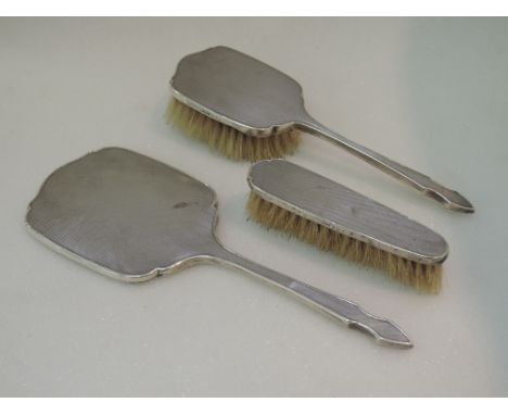 A three piece silver dressing table set having engine turned decoration, Birmingham 1950, WV G Sothers & Co