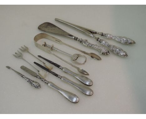 A pair of silver hors d'oeuvre forks having mother of pearl knops, Sheffield 1937, Viners, a pair of Victorian sugar nips, Lo