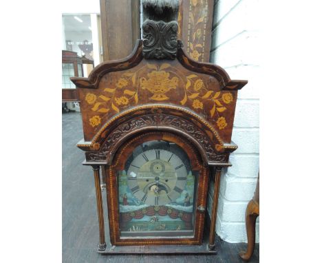 A longcase clock in the Dutch style having extensive marquetry work decoration of naturalistic form with rest and pillar hood