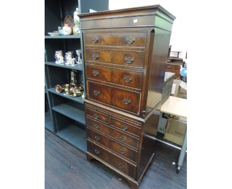 A late 20th century mahogany Georgian reproduction chest on chest on bracket feet