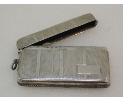 A double compartment silver vesta having engine turned decoration and plain cartouche, Birmingham 1924, makers mark worn