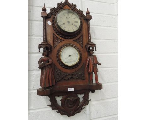 A late 19th century mahogany wall clock/barometer in the Austrian style having carved figure decoration, no clock movement