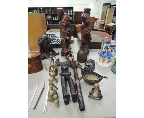 A selection of African and Far Eastern tribal art ornaments and similar including deities, figures, metalware, stick kvosh, j