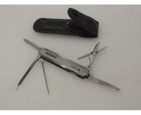 A multi blade pocket manicure/smokers  tool of petite form having a silver engine turned case, Sheffield 1935, Needham Brothe