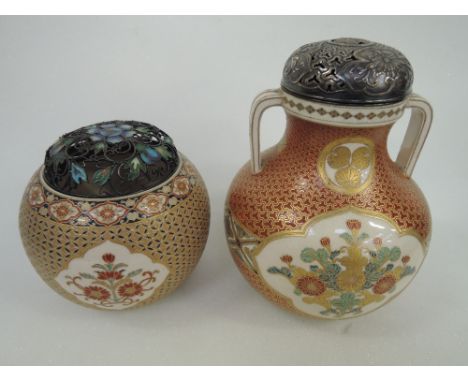 A 19th century Satsuma pottery two handled lidded jar having gilt heightened floral and scale decoration, with white metal pi