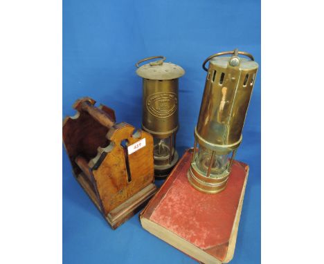 A vintage brass miner's lamp by Naylor Wigan, a brass Cumbrian miner's lamp by Thomas & Williams, a volume, Bulmer, Directory