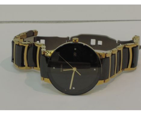 A gents Rado Centrix quartz wrist watch having diamond set quarter hours to dial with date aperture on a black ceramic and go