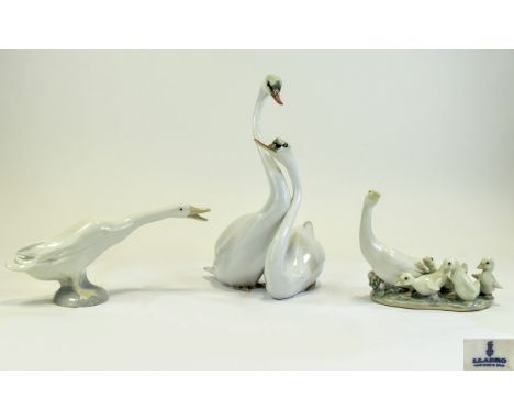 Lladro Figures ( 2 ) and 1 Other. Comprises 1/ Graceful Swans. 8 Inches High 2/ Duck, Model No 7909 3/ Little Ducks After Mot