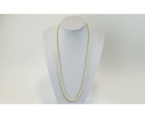 A Vintage Single Strand Cultured Pearl Necklace with Silver Clasp. Marked Silver. 26 Inches In length. 