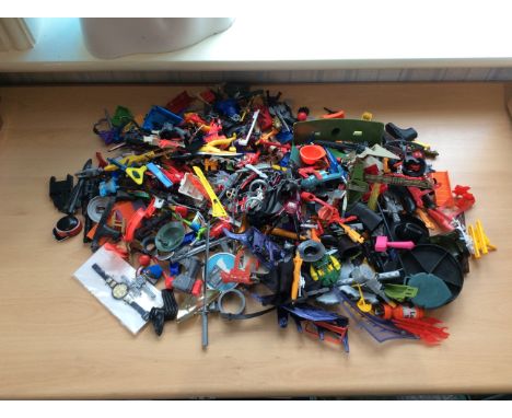 Box Containing A Quantity Of Vintage Action Figure Accessories & Weapons.