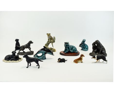 Collection of Animal Figures including Poole Pottery otter, dolphin and seal figures, Labrador figure, resin style figures an