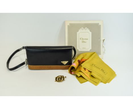 Vintage Yves Saint Laurent Cross Body Bag. Black rectangular shape with two internal pockets, central zipped pocket and front