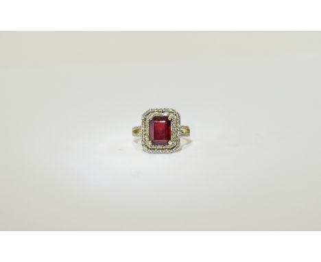 14ct Gold Ruby And Diamond Cluster Ring, Central Emerald Cut Ruby Surrounded By Round Modern Brilliant Cut Diamonds, Estimate