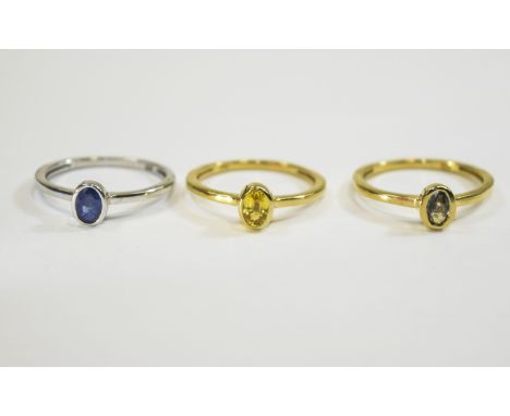 Green, Blue and Yellow Sapphire Triple Stacking Rings, three individual solitaire rings each bezel set with a .5ct sapphire, 