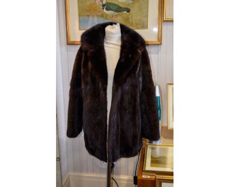 Mink Coat Ladies vintage mid length coat in very good condition. Dark plush fur with no visible signs of wear to pelt. Revere