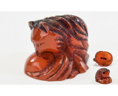 Carved Amber Coloured Netsuke In The Form Of A Stylised Cat, Rubbed Condition, Signed Character Mark To Base, Approx 1.25 Inc