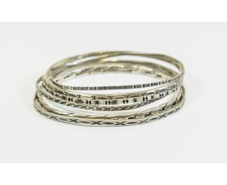 A Collection of Six Vintage Silver Bangles. All Fully Hallmarked. Assorted Designs and Nice Condition - Please See Photo. 