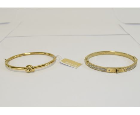Michael Kors Designer Bangles (2) in total. Gold tone bangle with crystal detail and accompanying bangle in eternity knot des