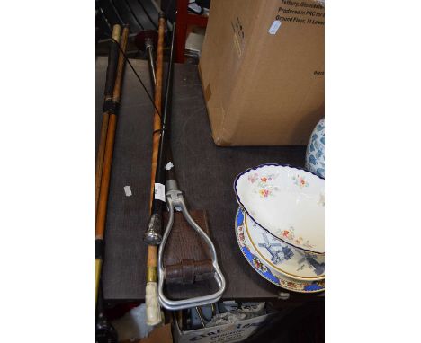 Shooting stick and two walking sticks