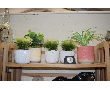 Group of ceramic planters and artificial plants