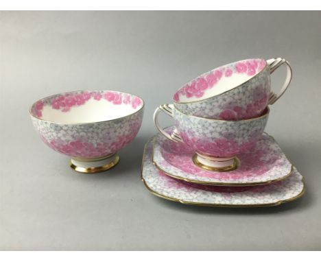 CANTEEN OF PLATED CUTLERY with beaded borders; along with a Paragon part tea service with floral decoration