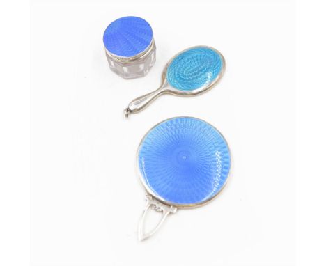 1920s silver and guilloche enamel hand mirror, of circular form with pierced handle, decorated verso with blue guilloche enam