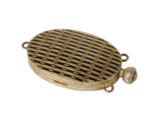 CONTINENTAL SILVER AND ENAMEL COMPACT, oval form, applied with black enamel linea lines with gilded stars, the interior to re
