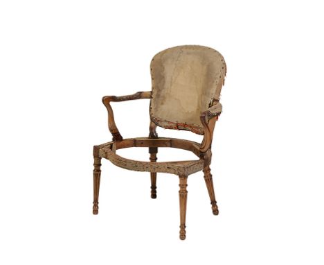 GEORGE III MAHOGANY ARMCHAIR in the manner of Thomas Chippendale with a cartouche-shaped back and shaped arms over a serpenti