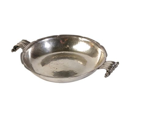 ARTS AND CRAFTS SILVER QUAICHE, by Cecil R. Walker, London, 1935, circular form, twin scroll handles, shaped border, planishe