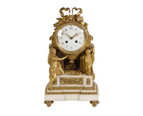 A LOUIS XVI STYLE ORMOLU AND MARBLE MANTEL CLOCK with an eight day bell striking movement and a white enamel dial with Arabic