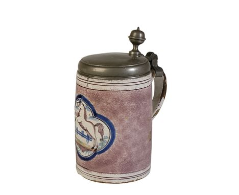 CONTINENTAL TIN GLAZED TANKARD painted with a quatrefoil panel of a leaping horse on a sponged manganese ground, the pewter l