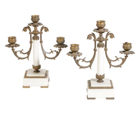 A PAIR OF LOUIS XVI STYLE WHITE MARBLE CANDELABRA, each with a central light flanked by twin scrolling acanthus branches, on 