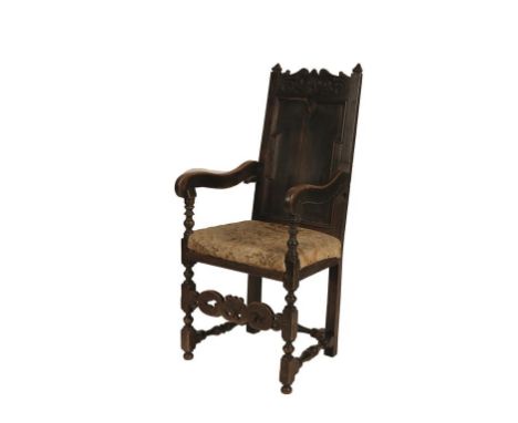 WILLIAM AND MARY STYLE OAK "WAINSCOT" CHAIR with a carved cresting rail over a bollection moulded panel and downswept arms, t