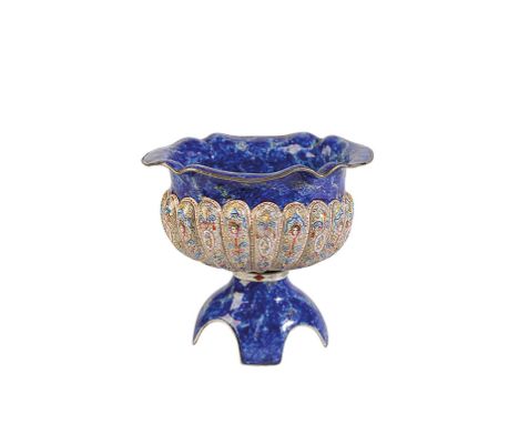 SMALL AUSTRIAN ENAMEL FOOTED BOWL, VIENNA, LATE 19TH CENTURY, the lobed sides painted with mask and floral motif, reserved ag