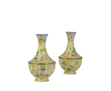 PAIR OF FAMILLE ROSE ENAMEL VASES, LATE QING / REPUBLIC PERIOD, the baluster sides decorated with foliate scrolls and butterf